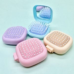 Cepillo plegable con espejo
